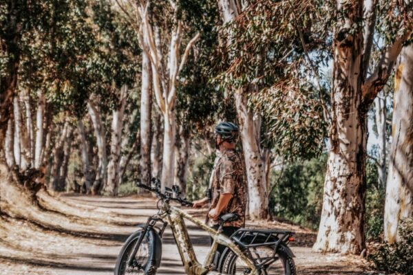 Soft tail mountain bike navigating uphill on a rocky trail.